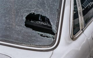 Car with wrecked glass window