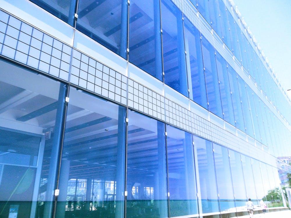 A shot of a blue glass building