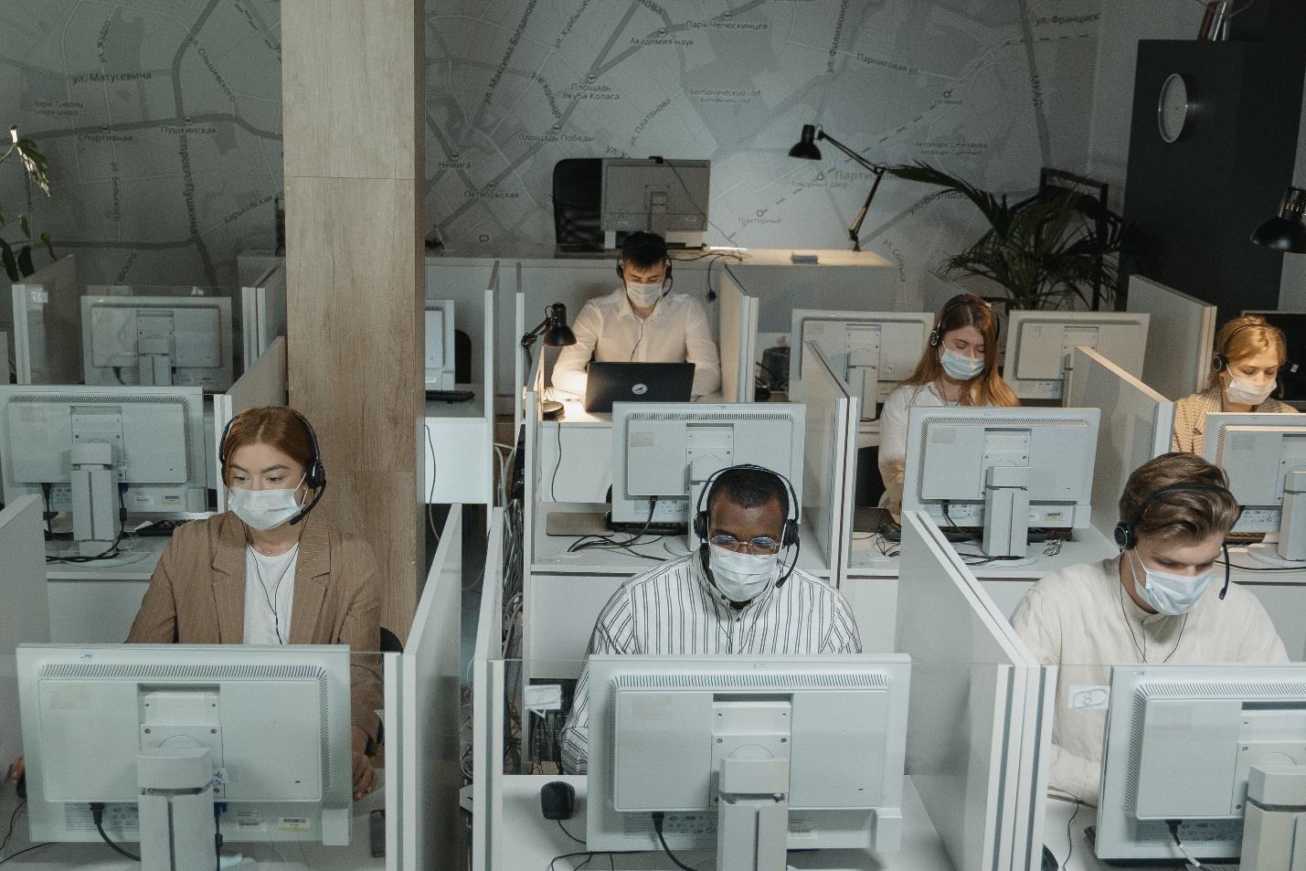 People working in an office during the pandemic