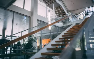 Glass Railings vs. Traditional Wood Railings - Which Suits Modern Homes