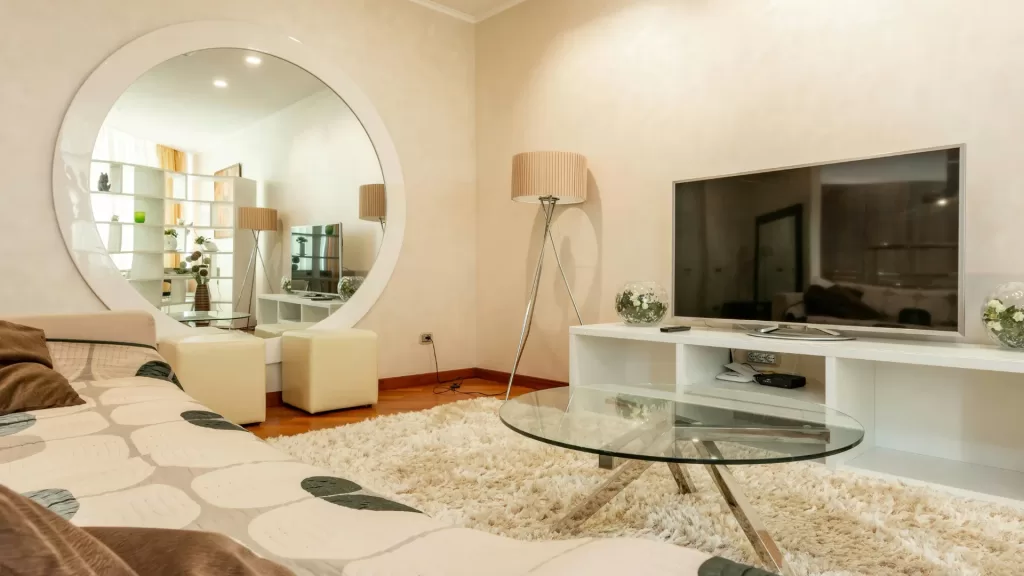 Large Round Mirror Placement to Expand Living Room Space