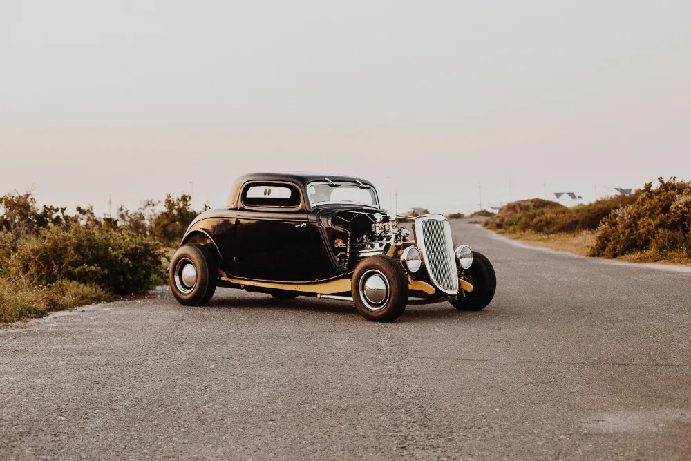 iconic curved windshield of the early 1900s Oldsmobile